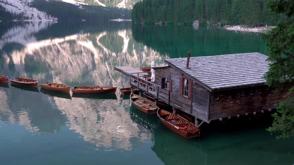 Wooden Boats and House on Summer Morning at Lago Di Braies, Italy