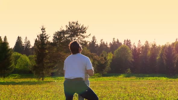 Father and Son Playing Outdoors at the Sunset Summer