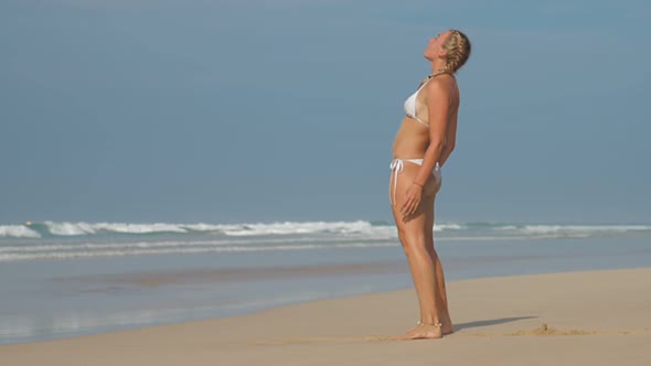 Young Woman Relaxes and Stands in Modern Yoga Bridge Pose