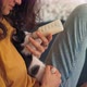 A Young Woman Feeding a Small Kitten From a Bottle - VideoHive Item for Sale