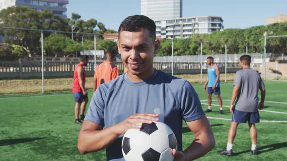 Soccer player looking at camera on the field