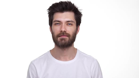 Attractive Man Friendly Smiling Yeah Gesture on White Background