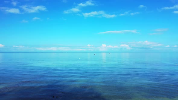 Daytime drone abstract view of a summer white paradise sand beach and aqua blue ocean background in 