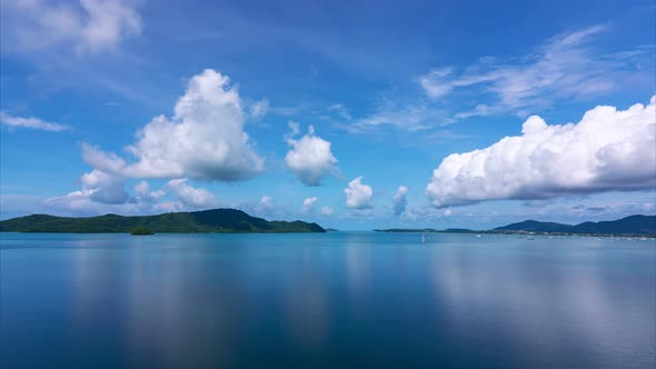 Amazing white clouds Time lapse Beautiful Blue sky and white clouds flowing over sea in summer seaso