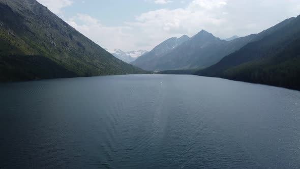 lake against the backdrop of white mountains