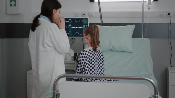 Pediatrician Woman Doctor Examining Sick Patient Using Medical Stethoscope