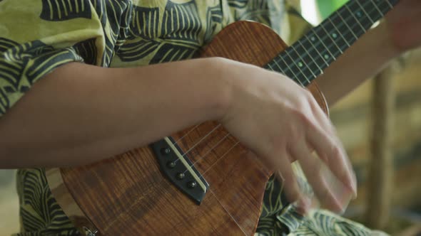 Man playing ukulele in Hawaii