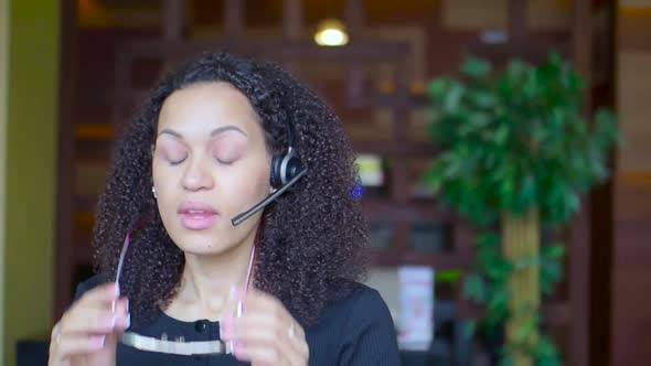 African American Woman Tired While Working on Laptop