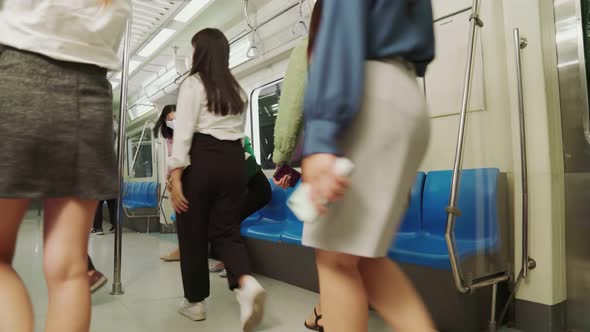 Crowd of People Wearing Face Mask on a Crowded Public Subway Train Travel