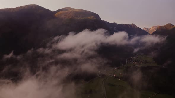 Panoramic View of a Picturesque Mountain Valley with a Village in a Lowland