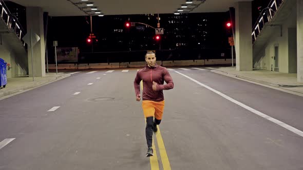 Athletic Male Running Through A Tunnel