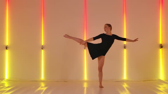 Attractive Dancer Emotionally Performs Modern Choreography of Contempt Against Backdrop of Red