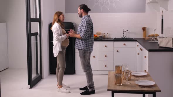 Couple Expecting Baby Quarreling in Home Kitchen