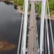 A Man Walks on a Rope Stretched Between the Supports of the Bridge at High Altitude. - VideoHive Item for Sale