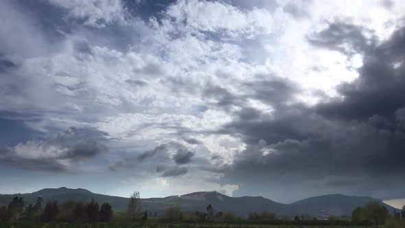 Variable Mix Weather and Clouds on Uncultivated Agricultural Orchards alt