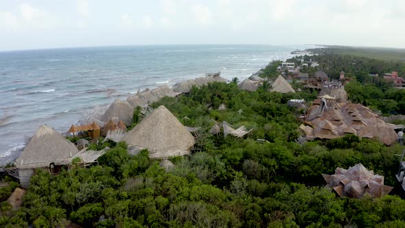 Beautiful Aerial View of the Eco Wooden Houses in the Middle of a Jungle