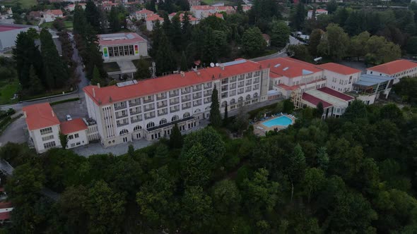 Golden Tulip Caramulo hotel and car museum in background, Portugal. Aerial orbit