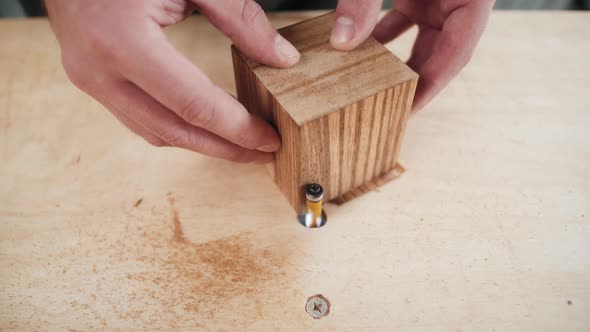 Close Up of Craftsman Hands Sanding the Surface of Handmade Wooden Box with Abrasive Paper Man