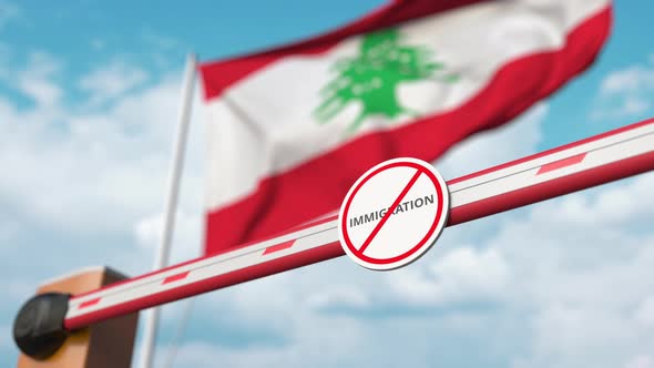 Opening Barrier with Stop Immigration Sign at Flag of Lebanon