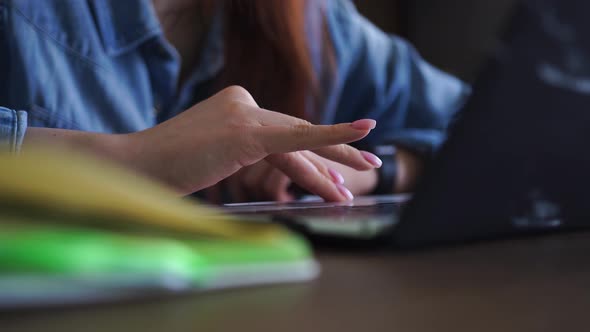 Female Student Preparing for Exam Session Working on Laptop at Home