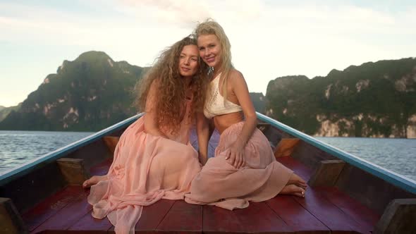 Picturesque Moment with Two Girls on a Boat