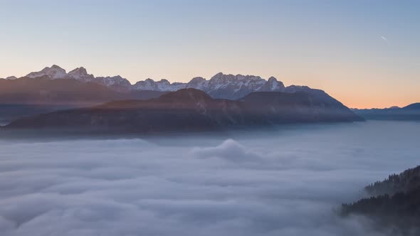 Sunset With Rolling Fog In The Mountains In The Julian Alps
