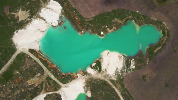 Aerial drone view Amazing industrial landscape, on Emerald lake in a flooded quarry