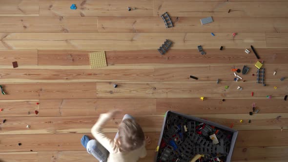 House Cleaning. Mom and Child Clean Up the Mess on the Floor in the Apartment, Timelapse, View From