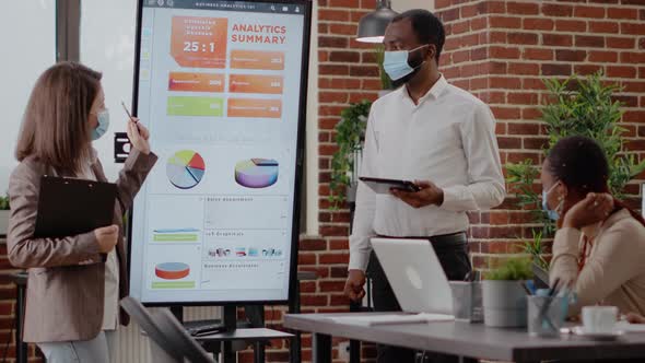 Team of Diverse Workmates Presenting Business Strategy on Display