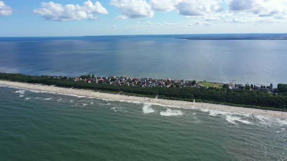 Baltic Sea, Aerial View of Chalupy city in Poland Sandy Beaches. Hel. People on the beach. Waves