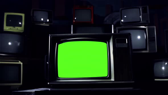 Old TV turning on Green Screen with Color Bars Among Many Retro TVs. Dark Tone. 4K Version.