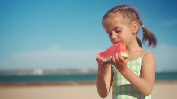Funny Little Girl Eat Watermelon Sunny Summer Day at Ocean Beach