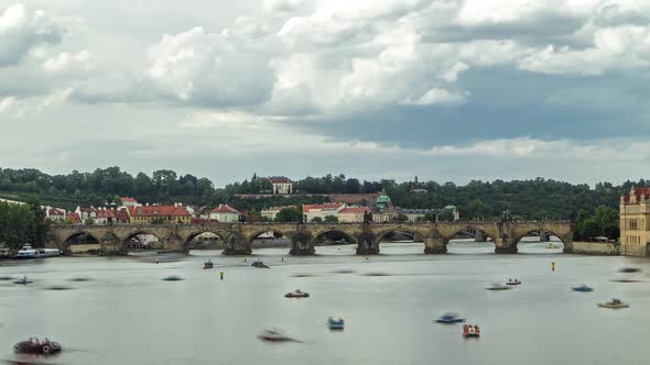 View of the City Prague in Czech Republic with Colorful Paddle Boats Timelapse on the Vltava River