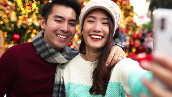 Merry Christmas and Happy New Year. Young  asian couple with Christmas