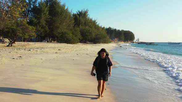 Lady enjoys life on perfect coastline beach vacation by transparent ocean with bright sandy backgrou