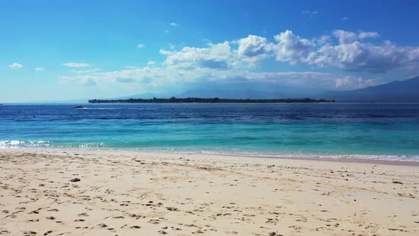 Aerial top down landscape of exotic resort beach holiday by turquoise ocean with white sandy backgro