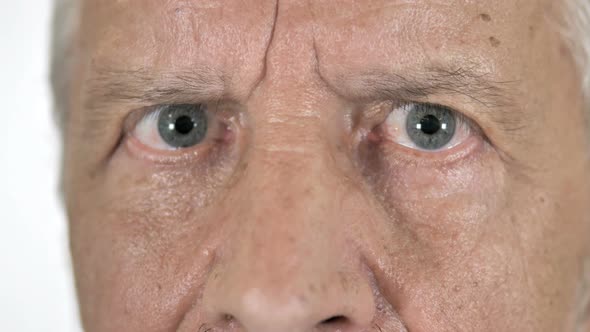 Close Up of Blinking Eyes of Old Man