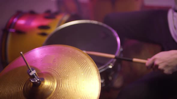 Unrecognizable Musician Playing Drum Kit