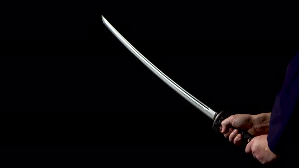 Japanese Katana Sword. Blade Close-up on a Dark Background
