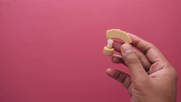 Hearing Aid Equipment on Hand Close Up