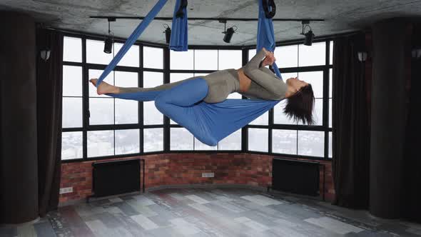 Woman Making Asana in Fly Yoga Class