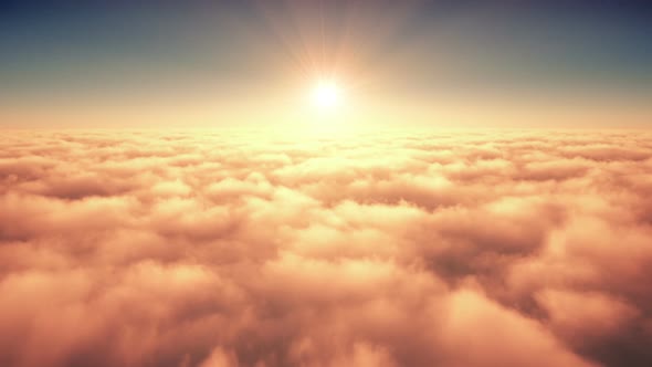 Flight Above The Clouds In The Rays Of Rising Sun