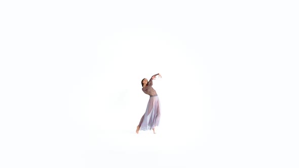 Young Woman Doing Modern Dance on a White Background
