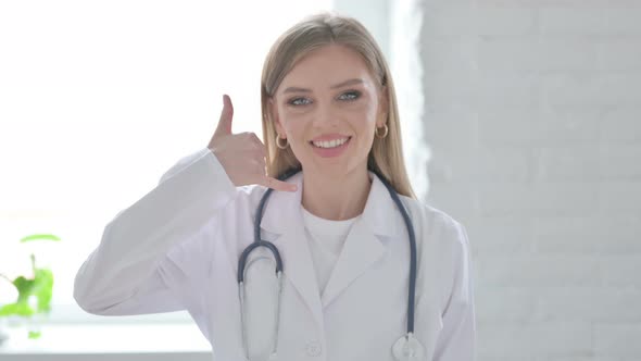 Portrait of Lady Doctor Showing Call Me Sign