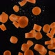 Chopped Carrot Falls in Water on Black Background - VideoHive Item for Sale
