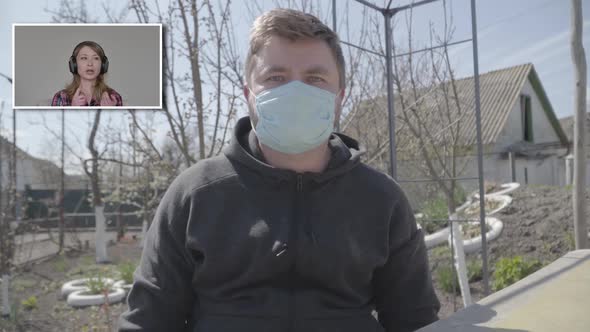 Portrait of Young Handsome Caucasian Man in Face Mask Agreeing with Colleague in Video Chat