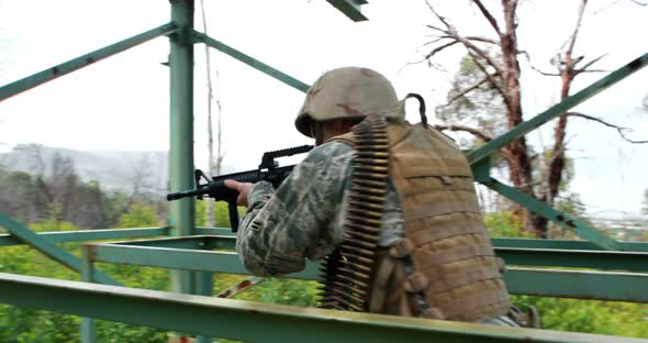 Military soldier guarding with a rifle