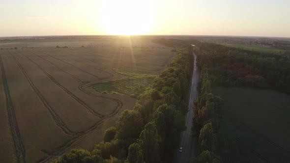 Aerial View Road Near Field At Sunset