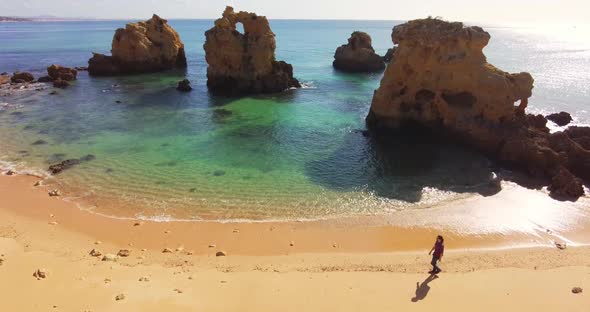 A Lonely Guy is Walking on a Empty Beach