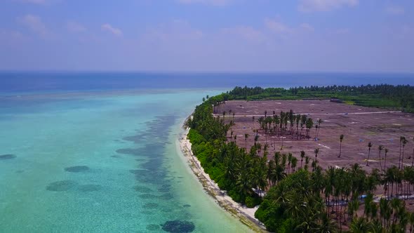 Drone aerial scenery of exotic seashore beach by blue sea with sand background